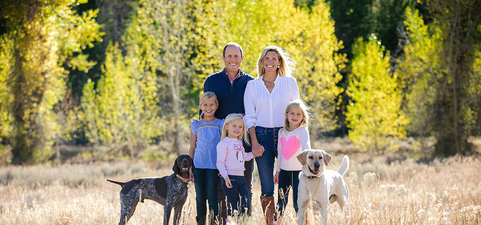 Aaron Hill and his family together with their two dogs