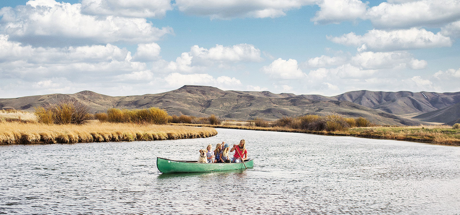 Erika Hill and her daughters riding a boat in a lake of Sun Valley