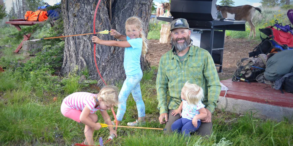 A man and three kids